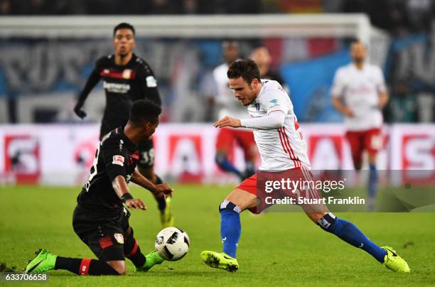 Nicolai Mueller of Hamburger SV is challenged by Wendell of Bayer Leverkusen during the Bundesliga match between Hamburger SV and Bayer 04 Leverkusen...