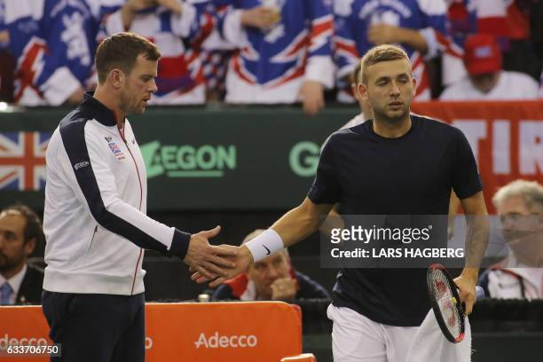Daniel Evans of Team Great Britain high fives his coach Leon Smith during the Davis Cup first round between Team Canada and Great Britain at TD Place...