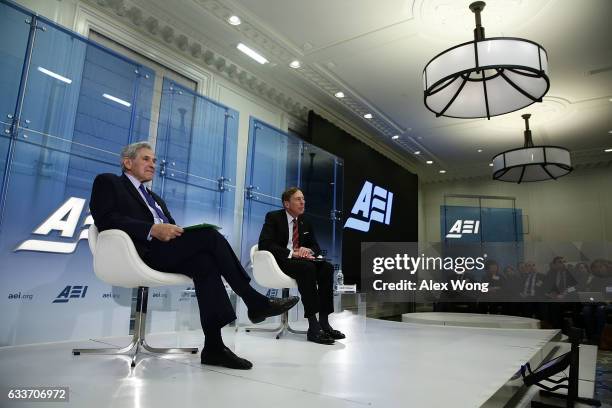 Former CIA Director and retired Army Gen. David Petraeus participates in a discussion with former Deputy U.S. Defense Secretary Paul Wolfowitz...