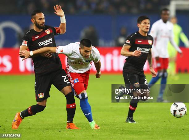 Bobby Wood of Hamburger SV is challenged by Omer Toprak of Bayer Leverkusen during the Bundesliga match between Hamburger SV and Bayer 04 Leverkusen...