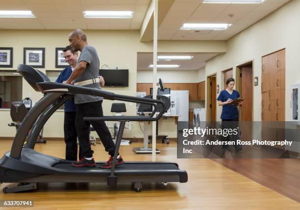 patient having physical therapy in hospital - workout recovery stock pictures, royalty-free photos & images