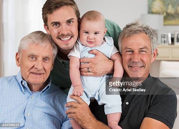 four generations of caucasian men smiling - great grandfather ストックフォトと画像