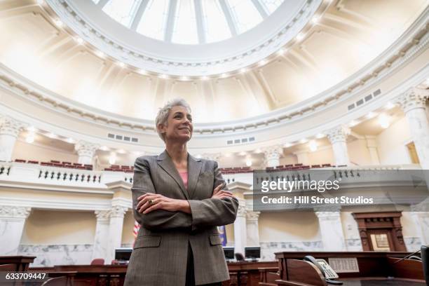 caucasian politician standing in capitol building - politician fotografías e imágenes de stock