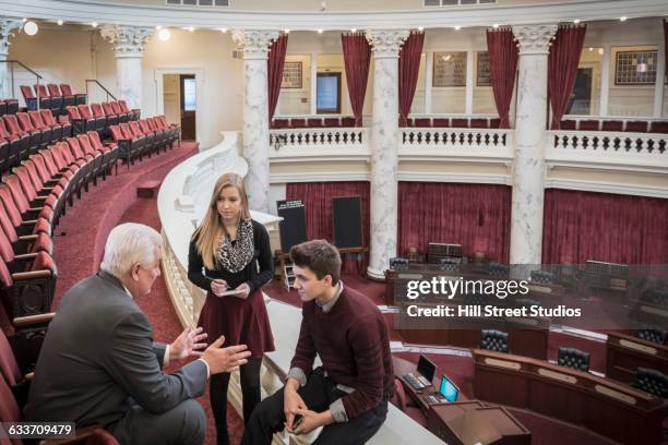 caucasian teenagers talking to politician in capitol building - student government stock pictures, royalty-free photos & images
