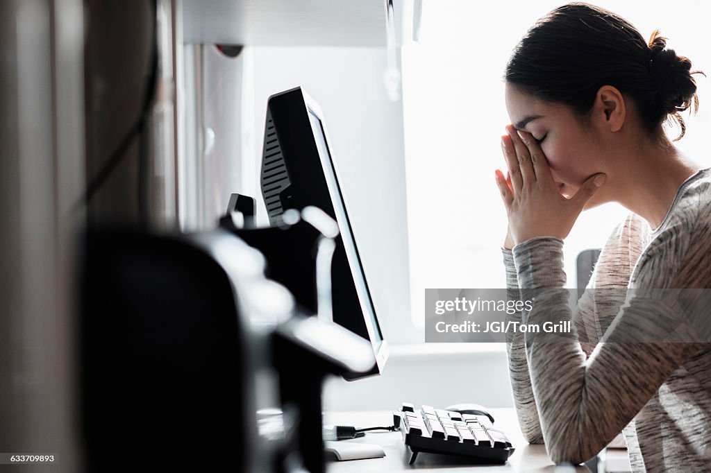 Hispanic woman using computer