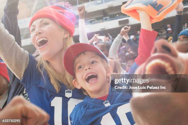 sports fans cheering in stadium - west new york new jersey stock-fotos und bilder
