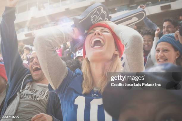 sports fan cheering in stadium - west new york new jersey stock-fotos und bilder