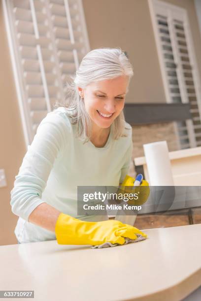 caucasian woman cleaning kitchen countertop - utah house stock pictures, royalty-free photos & images