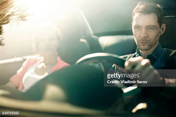caucasian father and daughter driving in car - sports car top imagens e fotografias de stock