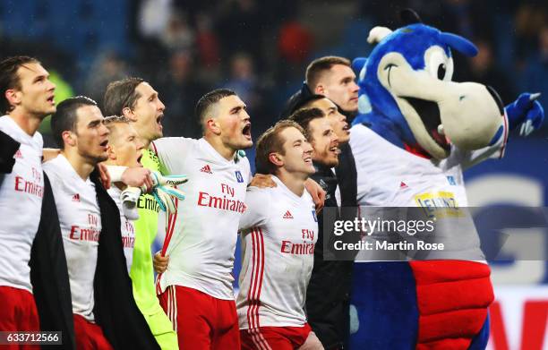 Kyriakos Papadopoulos and Rene Adler of Hamburger SV celebrate with team mates after victory in the Bundesliga match between Hamburger SV and Bayer...