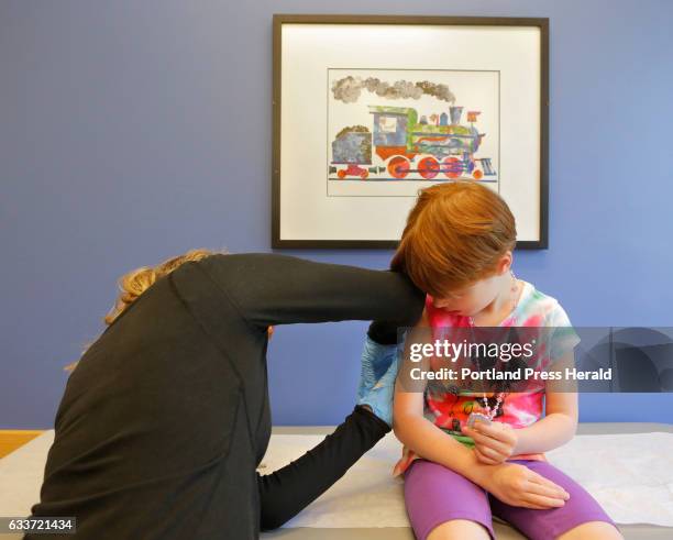 Kiara Boisvert gets a varicella booster vaccination from Amy Moran, a clinical assistant at Intermed in South Portland on Thursday, June 4, 2015.