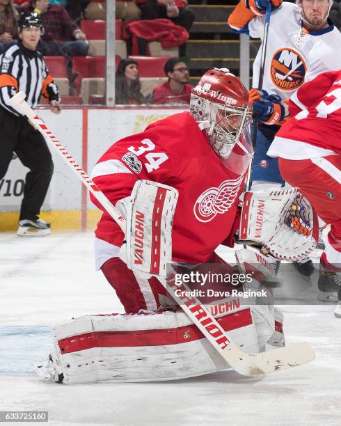 Petr Mrazek of the Detroit Red Wings makes a save during an NHL game against the New York Islanders at Joe Louis Arena on February 3, 2017 in...