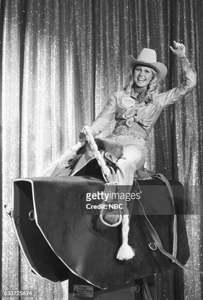 Pictured: 1973 Miss Rodeo America Pam Earnhardt riding mechanical bull on August 29th, 1975 --