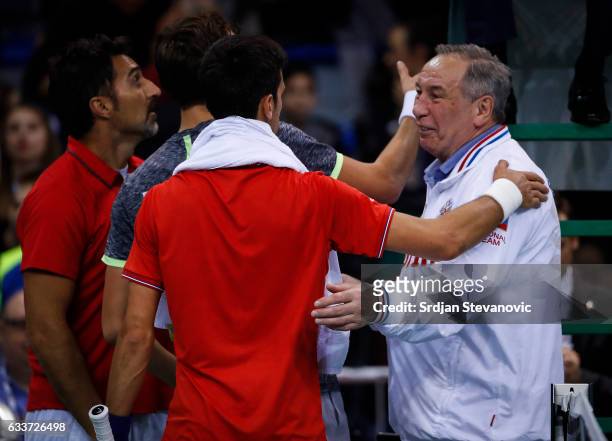 Novak Djokovic of Serbia salutes team captain Shamil Tarpischev of Russia after the Davis Cup World Group first round single match between Serbia and...