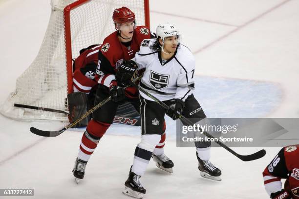 Los Angeles Kings center Jordan Nolan sets up a screen defended by Arizona Coyotes defenseman Connor Murphy during the NHL hockey game between the...