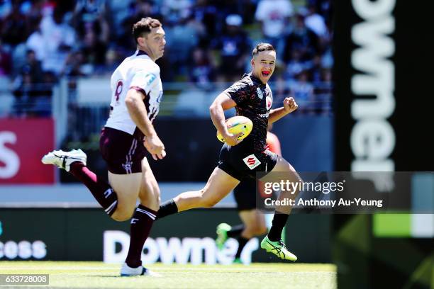 Sam Cook of the Warriors runs in a try in the first half during the 2017 Auckland Nines match between the Warriors and the Sea Eagles at Eden Park on...