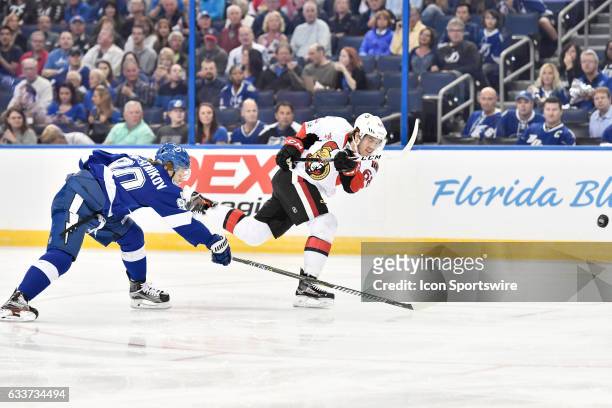 Ottawa Senators left wing Mike Hoffman avoids the stick-check of Tampa Bay Lightning center Vladislav Namestnikov and takes a shot during the first...