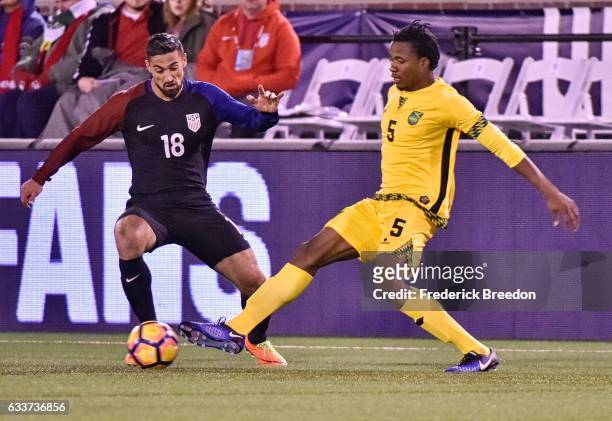 Sebastian Lletget of USA plays against Alvas Powell of Jamaica during the first half of a friendly match at Finley Stadium on February 3, 2017 in...