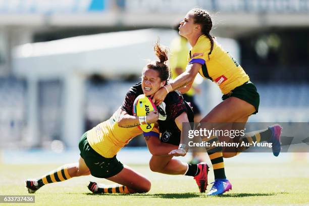 Lilieta Maumau of the Kiwi Ferns is tackled by Ali Brigginshaw and Isabelle Kelly of the Australian Jillaroos during the 2017 Auckland Nines match...