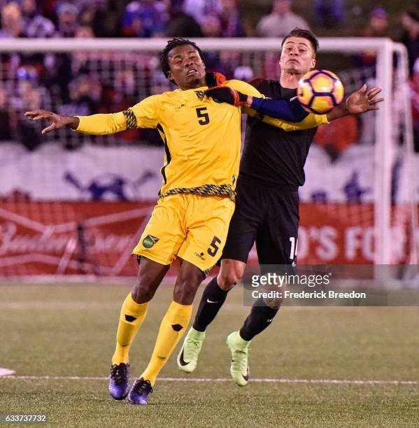 Alvas Powell of Jamaica and Jorge Villafana of USA fight for a ball during the second half of a friendly international match at Finley Stadium on...