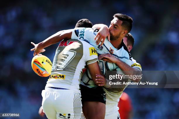 Gerard Beale of the Sharks offloads in the tackle from Tyrone May of the Panthers during the 2017 Auckland Nines match between the Sharks and the...