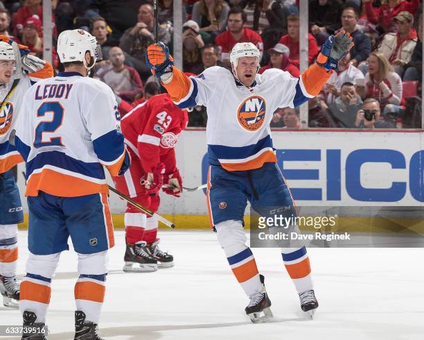 Jason Chimera of the New York Islanders celebrates his third period goal with teammate Nick Leddy during an NHL game against the Detroit Red Wings at...