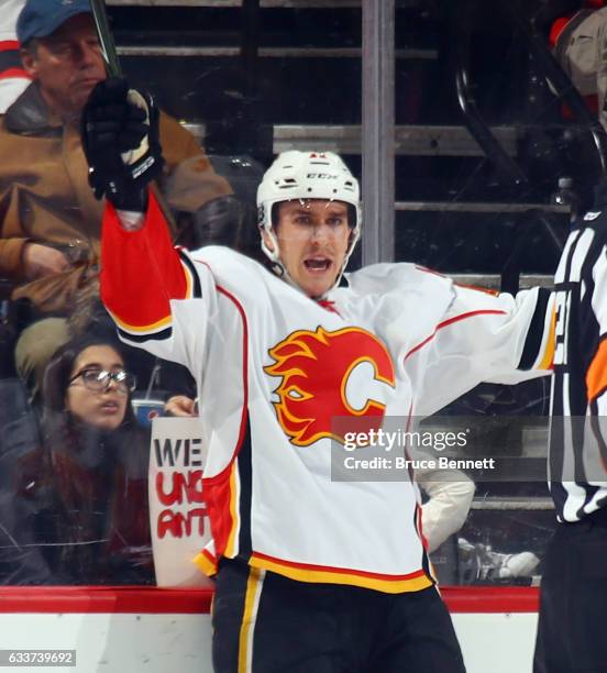 Mikael Backlund of the Calgary Flames celebratse his game winning overtime goal against the New Jersey Devils at the Prudential Center on February 3,...