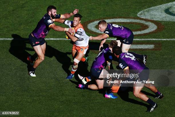 Luke Brooks of the Wests Tigers fends against Mark Nicholls of the Storm during the 2017 Auckland Nines match between the Wests Tigers and the Storm...