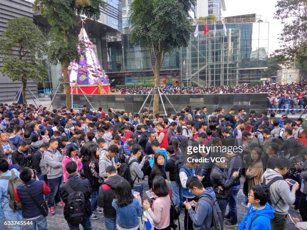 Tencent employees queue up for red envelopes at the company's headquarter on February 4, 2017 in Shenzhen, Guangdong Province of China. Tencent CEO...