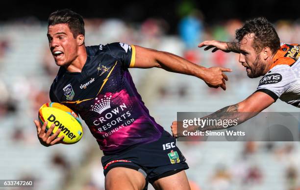 Brodie Croft of the Storm beats the tackle of Jordan Rankin of the Tigers during the 2017 Auckland Nines match between the Wests Tigers and the...