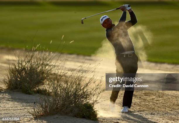 Graeme McDowell of Northern Ireland plays his second shot on the par 4, eighth hole during the completion of the weather delayed second round of the...