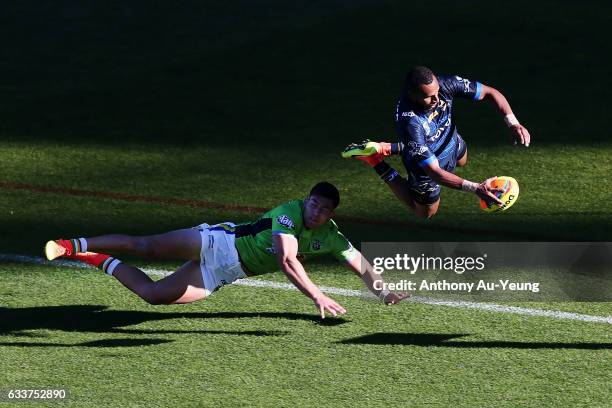 Gideon Gela-Mosby of the Cowboys scores a try against Nick Cotric of the Raiders during the 2017 Auckland Nines match between the Cowboys and the...