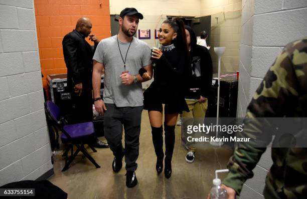 Scooter Braun and Ariana Grande walk backstage during the "Dangerous Woman" Tour Opener at Talking Stick Resort Arena on February 3, 2017 in Phoenix,...