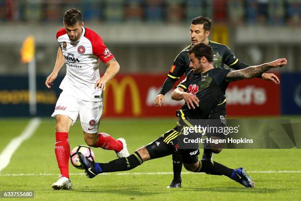 Tom Doyle of the Phoenix tackles Brendan Hamill of the Wanderers during the round 18 A-League match between the Wellington Phoenix and the Western...