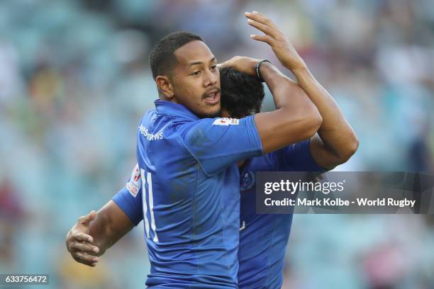 Ed Fidow and Tila Mealoi of Samoa celebrate a try during the Men Pool B match between Samoa and Wales in the 2017 HSBC Sydney Sevens at Allianz...