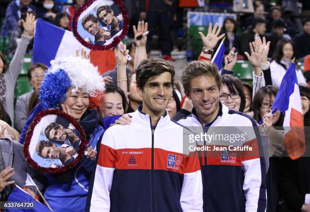 Pierre-Hughes Herbert and Nicolas Mahut of France pose with fans after winning the doubles match and the tie 3-0 on day 2 of the Davis Cup World...