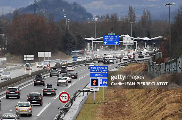 Vehicles caught in a traffic jam drive at a slow pace on to the A43 highway between Chambery and Albertville, before the Tarentaise valley, on...