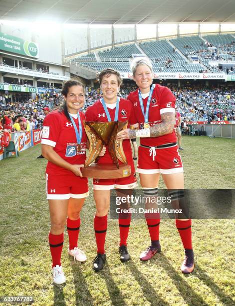 Canadian players Ashley Steacy, Ghislaine Landry and Jen Kish pose for a picture with their trophy after winning the Women's Final match against USA...