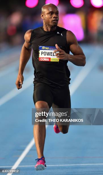 Bolt All Stars team member Asafa Powell of Jamaica looks over to his left as he takes part the Men's 60 metre at the Nitro Athletics meet in the...