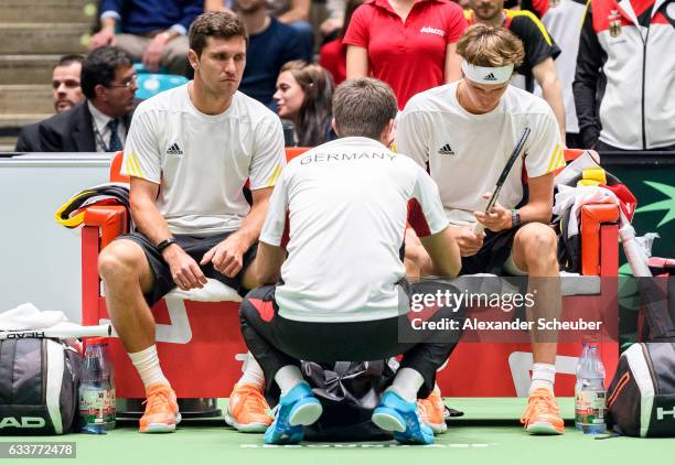 Alexander Zverev of Germany and Mischa Zverev of Germany are seen with team captain Michael Kohlmann of Germany during day two of the Davis Cup World...