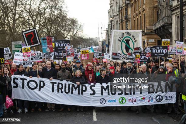 Thousands of protesters with banners and placards march through central London during a demonstration against U.S. President Donald Trump on February...