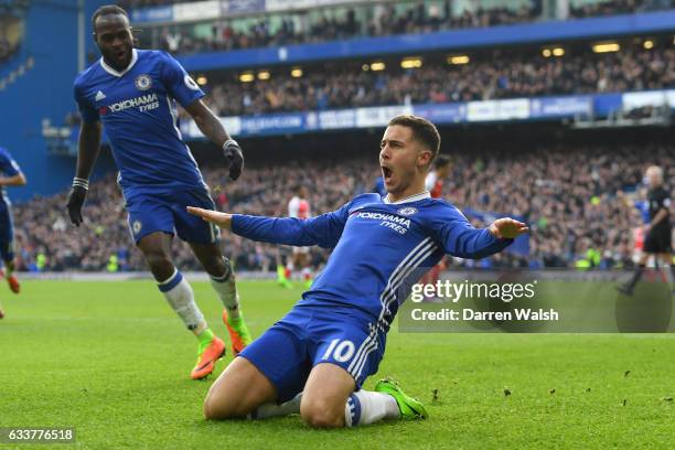 Eden Hazard of Chelsea celebrates with team-mates after scoring his team's second goal during the Premier League match between Chelsea and Arsenal at...