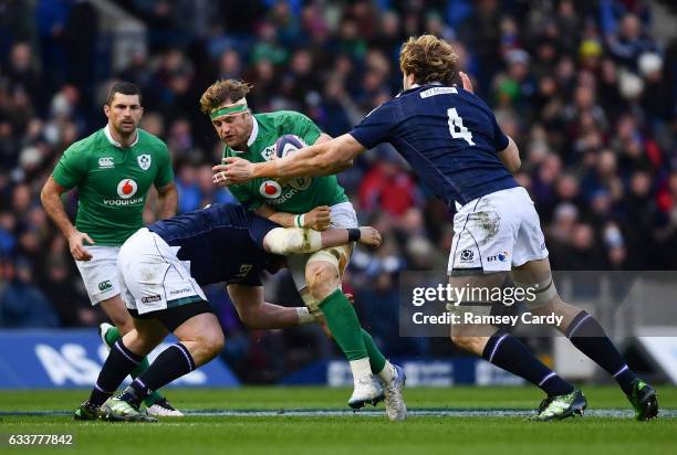 Edinburgh , United Kingdom - 4 February 2017; Jamie Heaslip of Ireland is tackled by Zander Fagerson, left, and Richie Gray of Scotland during the...