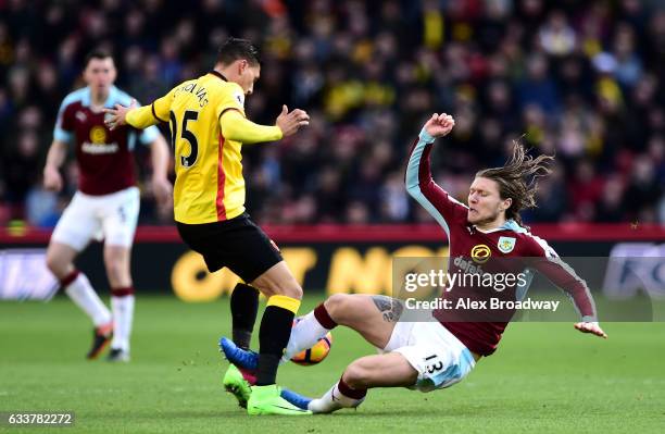 Jeff Hendrick of Burnley fouls on Jose Holebas of Watford resulting in the red card during the Premier League match between Watford and Burnley at...