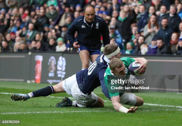 Keith Earls of Ireland scores his teams first try during the RBS 6 Nations match between Scotland and Ireland at Murrayfield Stadium on February 4,...
