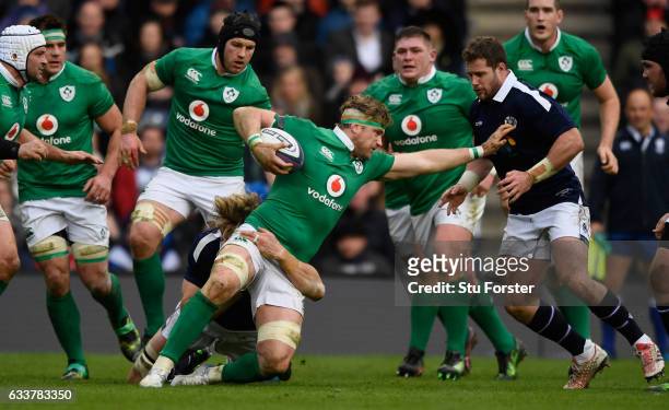 Ireland player Jamie Heaslip runs into the Scotland defence during the RBS Six Nations match between Scotland and Ireland at Murrayfield Stadium on...