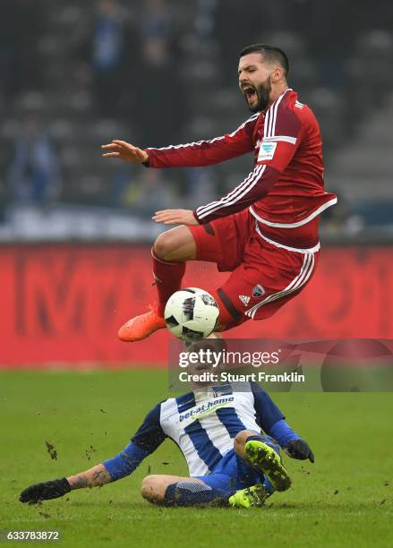 Fabian Lustenberger of Berlin is challenged by Anthony Jung of Ingolstadt during the Bundesliga match between Hertha BSC and FC Ingolstadt 04 at...