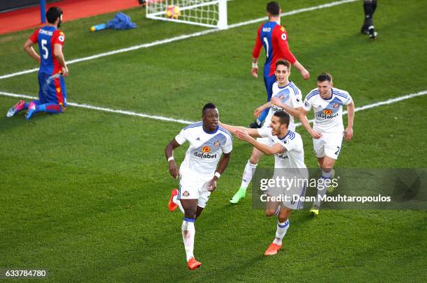 Lamine Kone of Sunderland celebrates scoring the opening goal with his team mates during the Premier League match between Crystal Palace and...