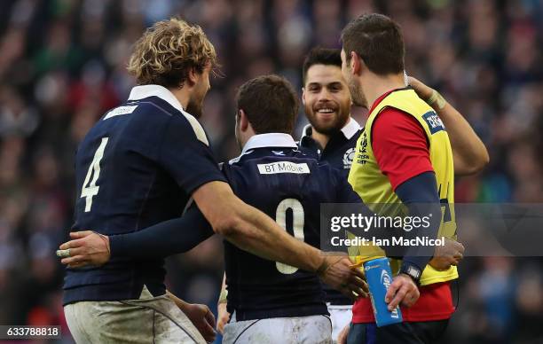 Team mates congratulate Greig Laidlaw of Scotland at full time during the RBS 6 Nations match between Scotland and Ireland at Murrayfield Stadium on...