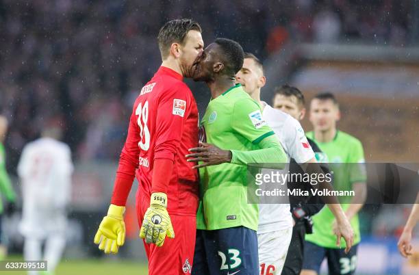 Goalkeeper Thomas Kessler of Cologne and Josuha Guilavogui of Wolfsburg get agitated during the Bundesliga match between 1. FC Koeln and VfL...